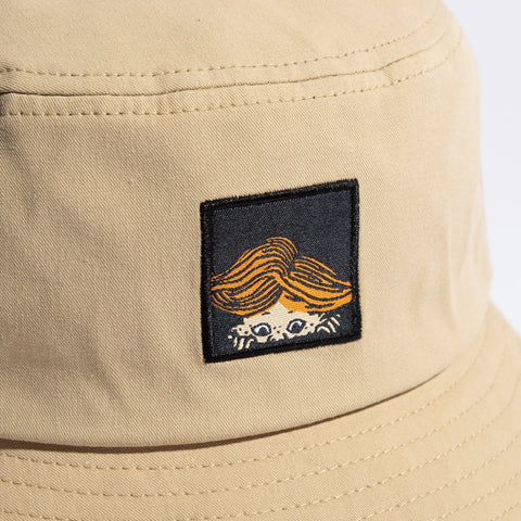 5. Close-up of Pippi Longstocking logo on beige bucket hat by NordicBuddies