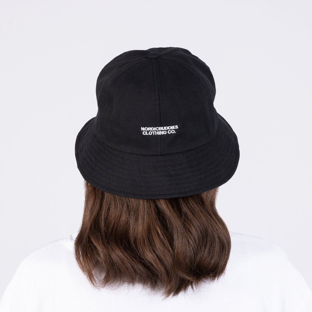 2. Women's black Pippi Longstocking bucket hat by NordicBuddies shown from the back with logo