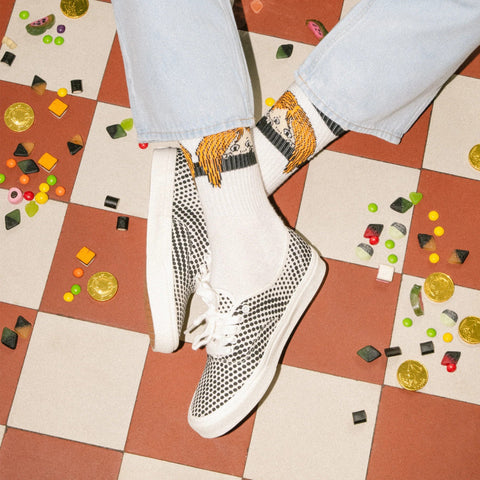 1. Men's Pippi Longstocking retro socks by NordicBuddies in lifestyle setting, worn with casual shoes on checkered floor