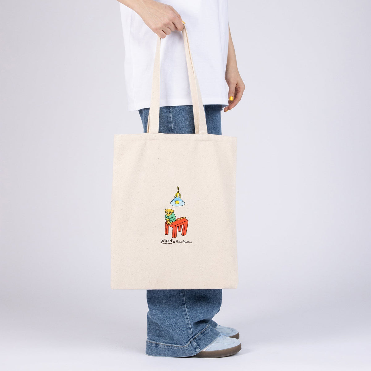 2. Women's Pippi Tote Bag - Cleaning Day by Moomin, natural white, reverse side in lifestyle setting