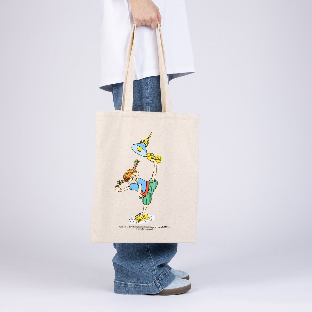1. Women's Pippi Tote Bag - Cleaning Day by Moomin, natural white, shown in lifestyle setting