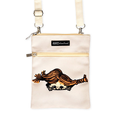 2. Studio shot of Pippi Passport Bag in beige featuring Pippi Longstocking design and NordicBuddies branding