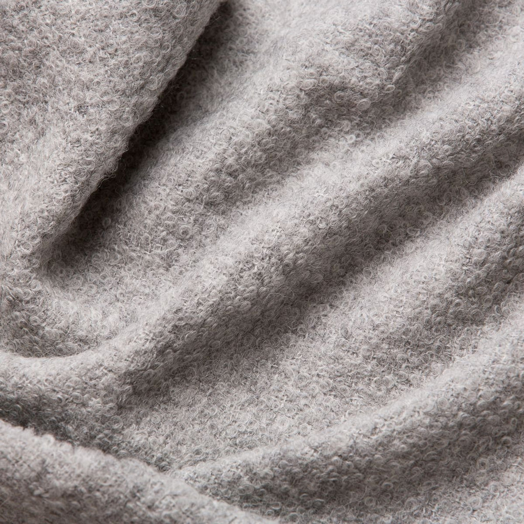 5. Close-up of grey superfine alpaca wool boucle fabric, showcasing detailed texture and craftsmanship