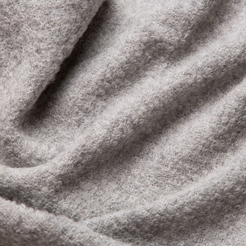 5. Close-up of grey superfine alpaca wool boucle fabric, showcasing detailed texture and craftsmanship