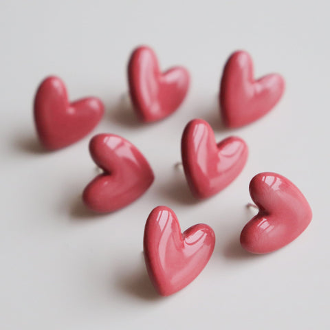 5. Multiple Rozenthal pink porcelain heart earrings with sterling silver studs in a group display