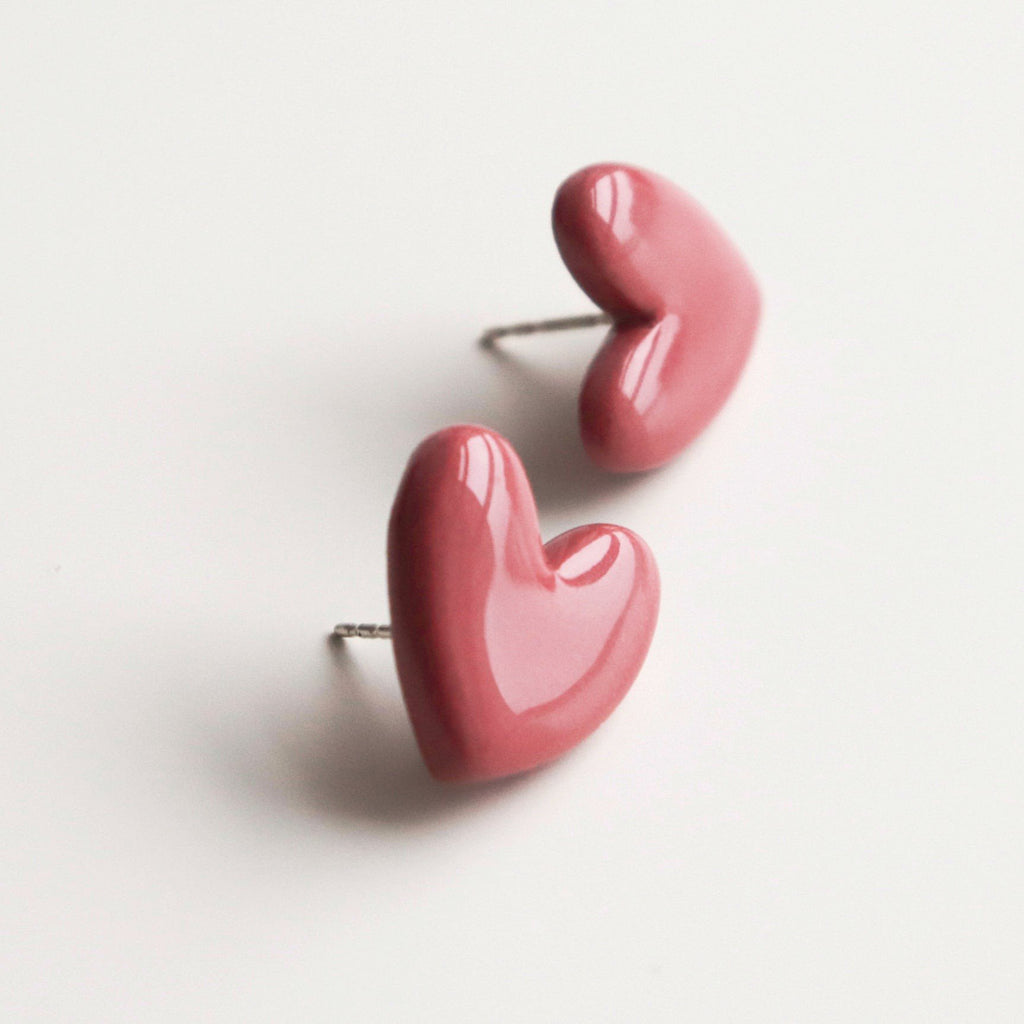3. Studio shot of Rozenthal pink porcelain heart earrings with hypoallergenic sterling silver studs