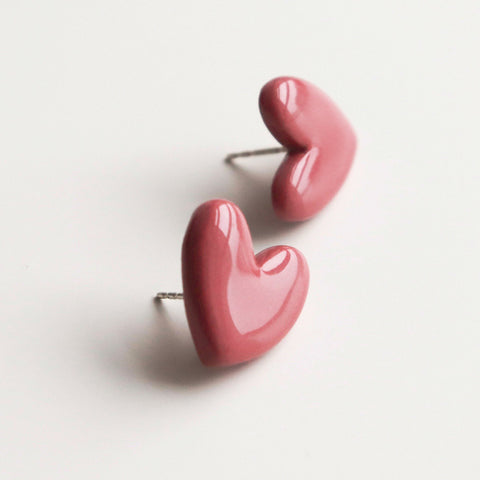 3. Studio shot of Rozenthal pink porcelain heart earrings with hypoallergenic sterling silver studs