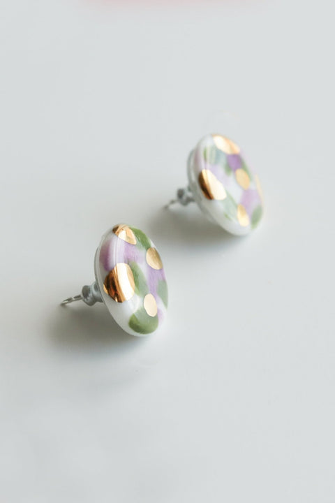 2. Close-up of Rozenthal Porcelain Tache Studs in green and violet with 24k gold detailing on sterling silver