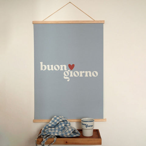 1. Terra Mamma 'Buongiorno' poster in minimalist design with Italian typography, hanging on wall above wooden shelf with checkered cloth and matching mug, creating a cozy interior vibe