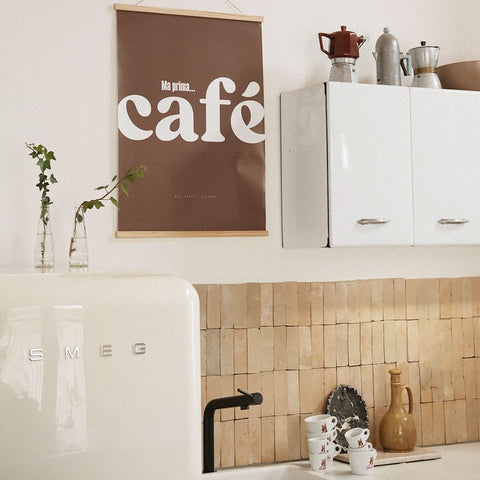 4. Cafe poster with Italian typography in a kitchen setting with a vintage fridge and kitchenware