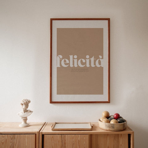 1. Terra Mamma Felicita poster with Italian typography in wooden frame on wall above wooden cabinet with decorative items