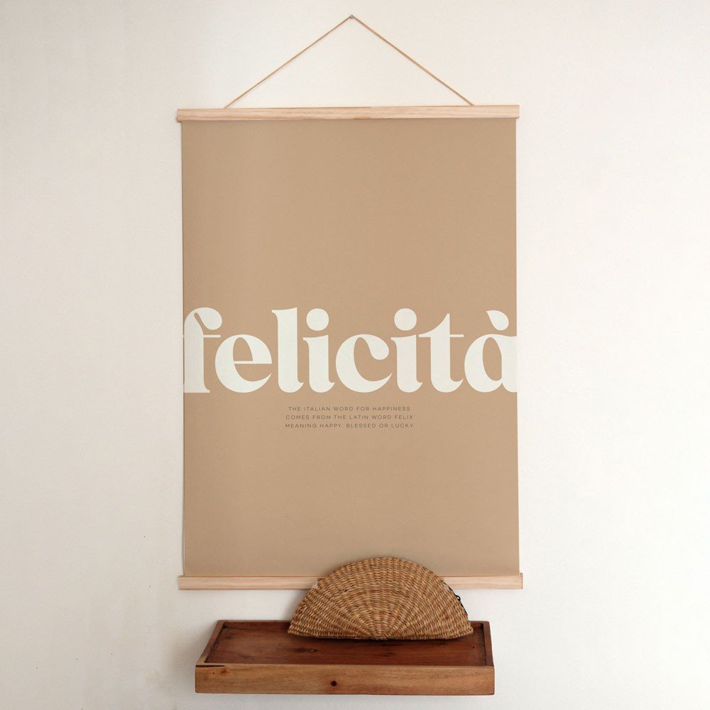 4. Terra Mamma Felicita poster with Italian typography hanging on wall with wooden frame and decorative basket