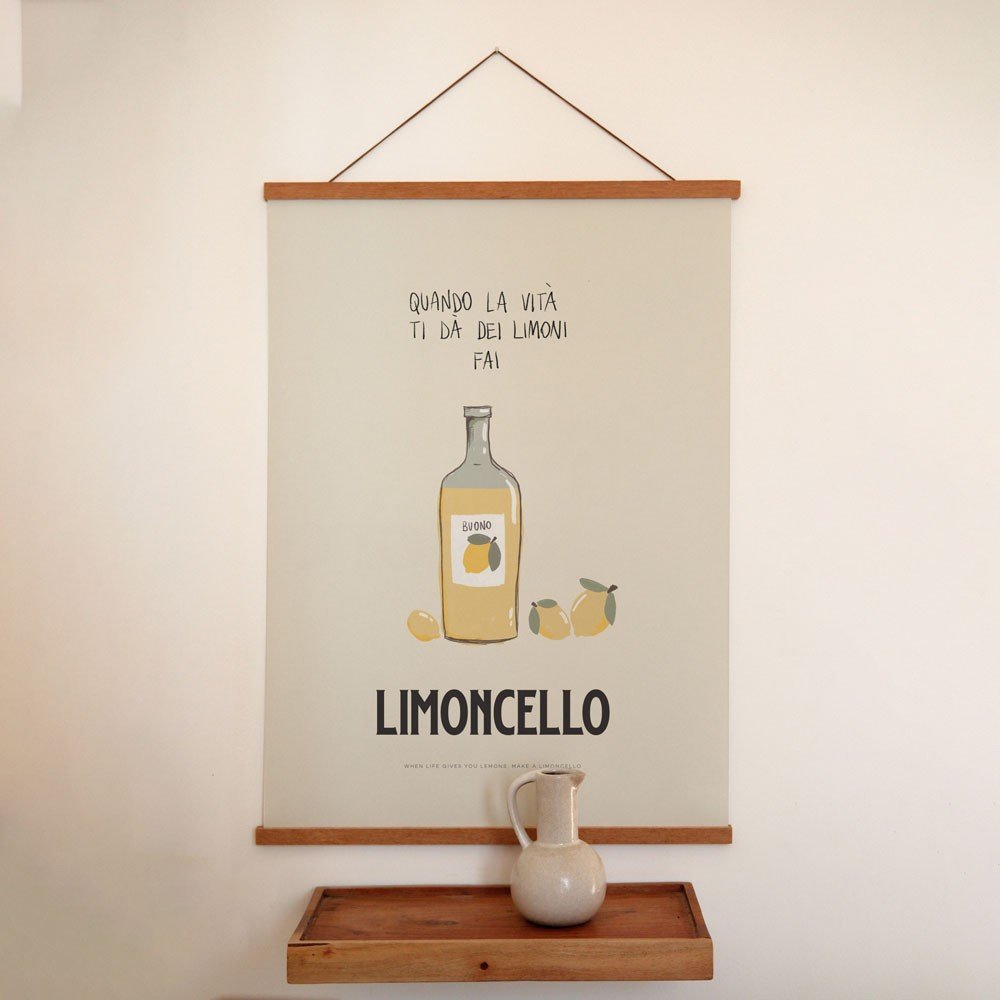 1. Terra Mamma Limoncello poster with Italian typography and bottle illustration hanging on wall above wooden shelf with ceramic jug