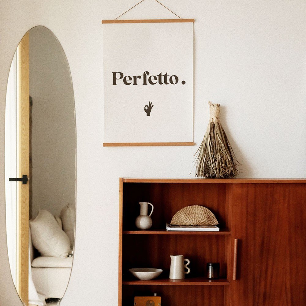 4. Perfetto poster in a stylish interior with a wooden cabinet, oval mirror, and natural decor elements