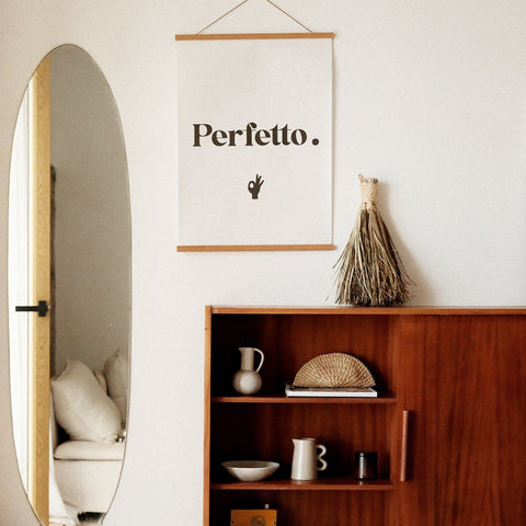 4. Perfetto poster in a stylish interior with a wooden cabinet, oval mirror, and natural decor elements