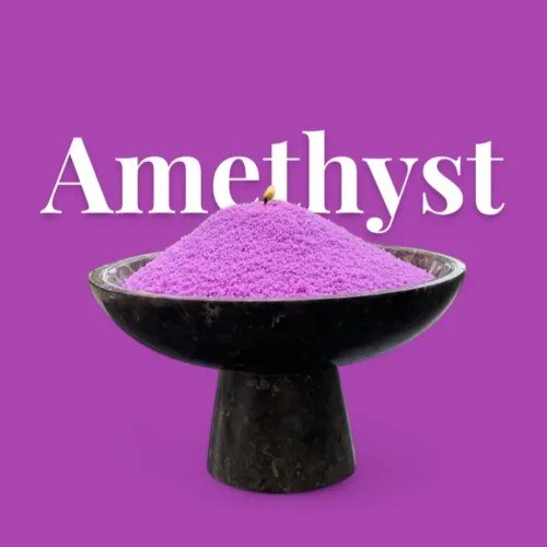 2. Amethyst powdered candle sand in black bowl with visible wick on purple background