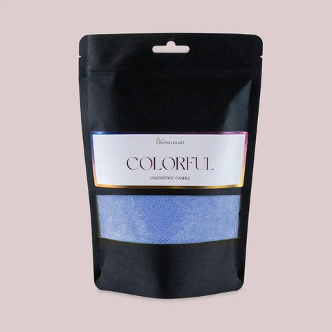 2. Candledust powdered candle refill kit in unscented dark blue, packaged in a black pouch with colorful label, on a light background