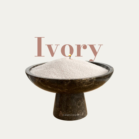 2. Ivory powdered candle in dark stone bowl with single wick, featuring Candledust logo and text 'Ivory' on light background