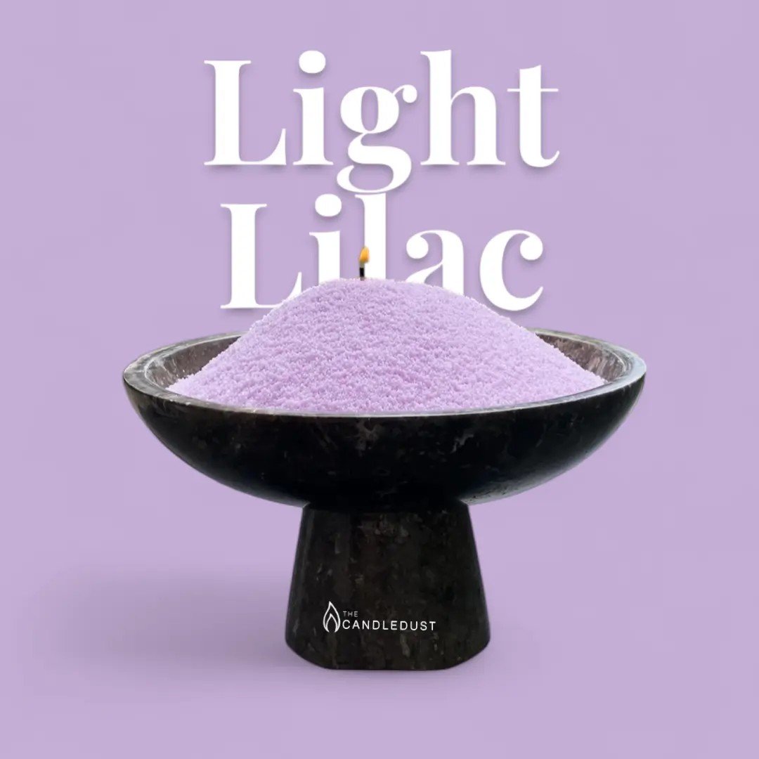 2. Light lilac candle sand in a black bowl with a wick, set against a matching lilac background with text
