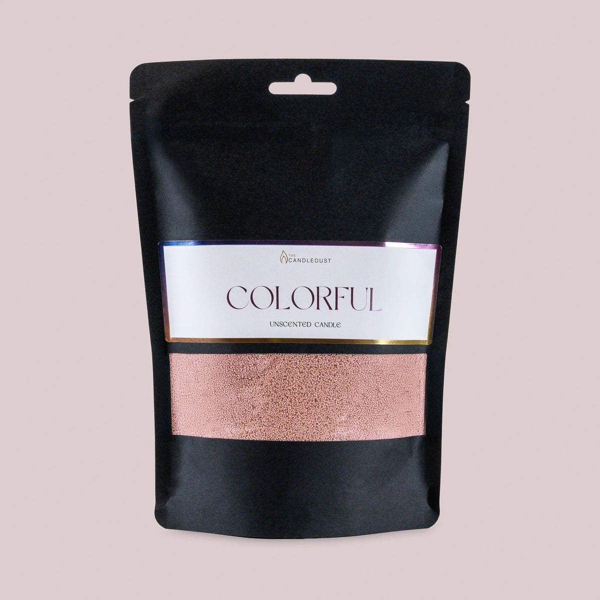 1. Black pouch of Candledust unscented candle sand in mocha mousse color with colorful label on light pink background