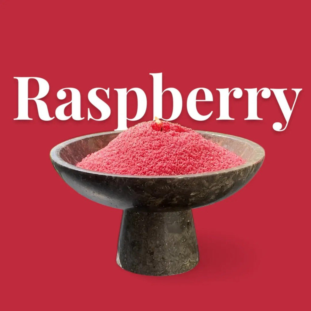 4. Raspberry-colored candle sand in black pedestal bowl with text 'Raspberry' on red background