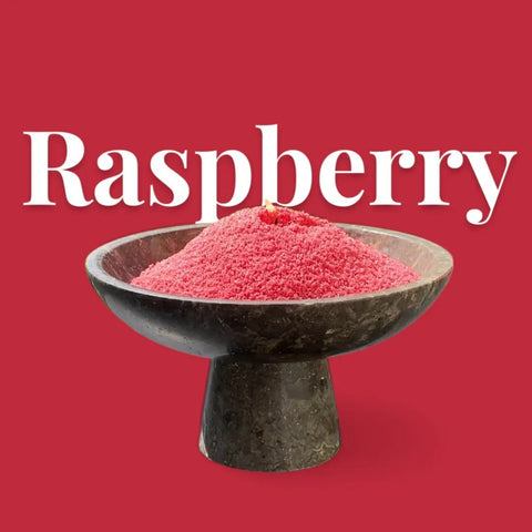 4. Raspberry-colored candle sand in black pedestal bowl with text 'Raspberry' on red background