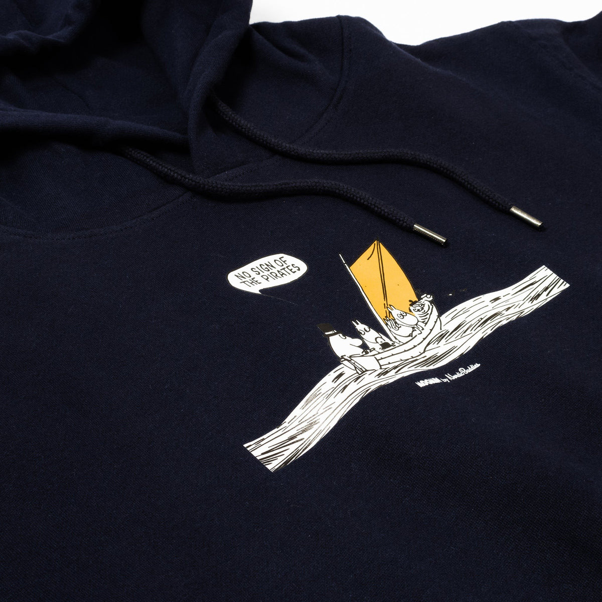2. Close-up of Moomin graphic on navy hoodie showing characters in boat with yellow sail and text bubble
