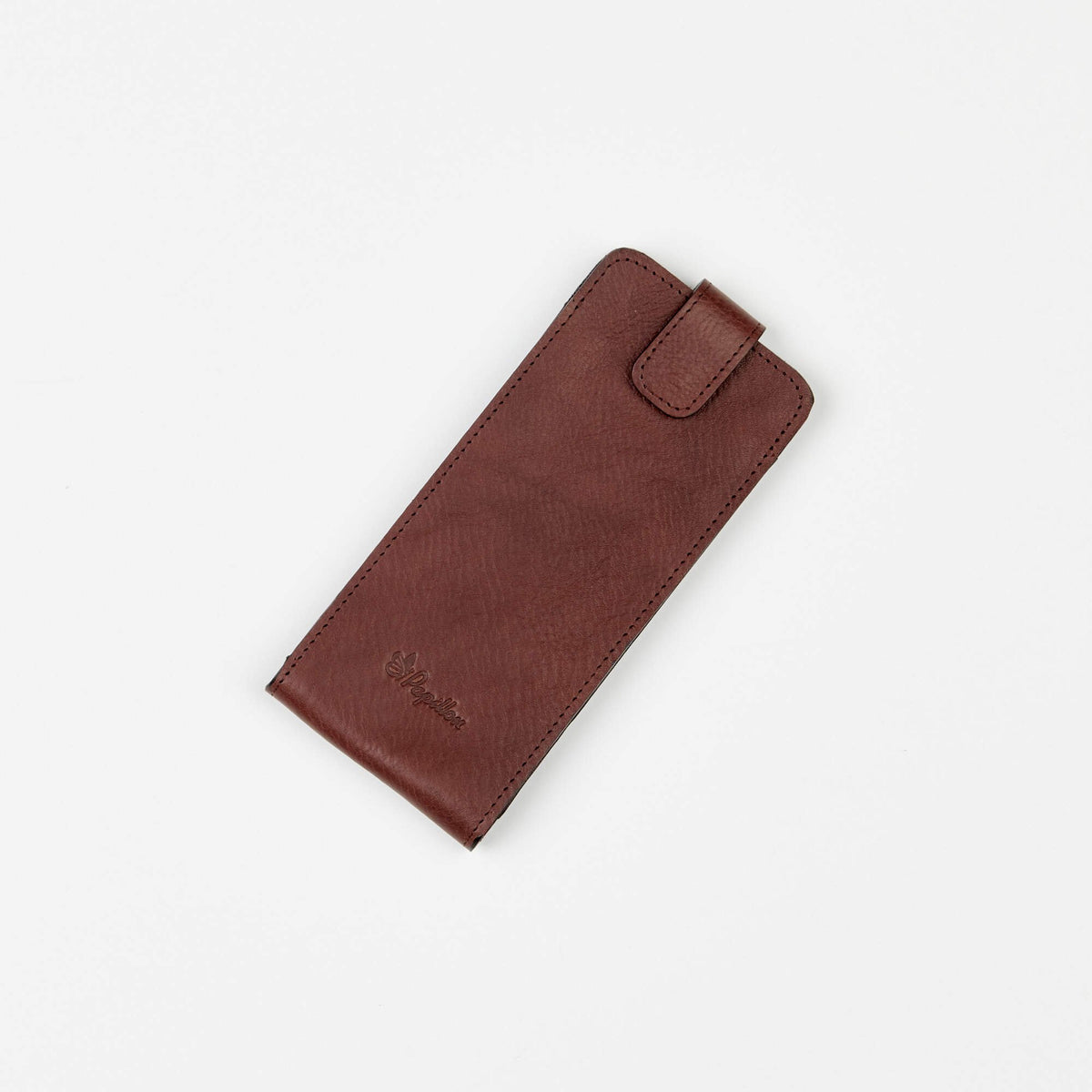 2. Studio shot of Papillon leather glasses case in brown, featuring embossed logo and secure closure