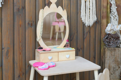 3. Close-up of natural wood princess beauty table with mirror, drawers, and pretend makeup accessories