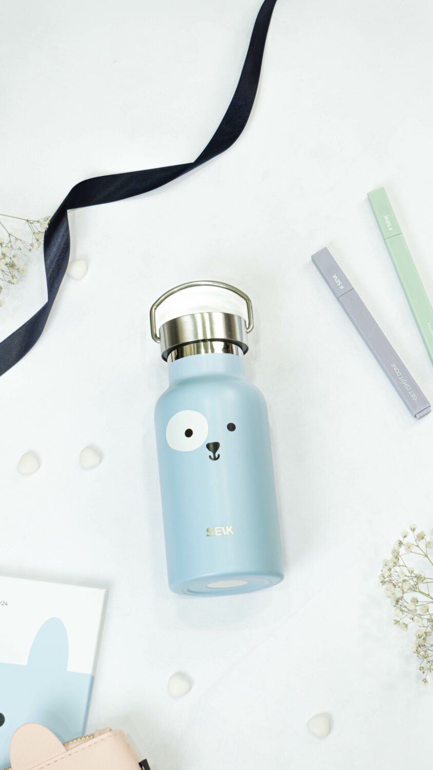 4. SEIK blue puppy-themed thermos, 350ml, styled with accessories in studio setting