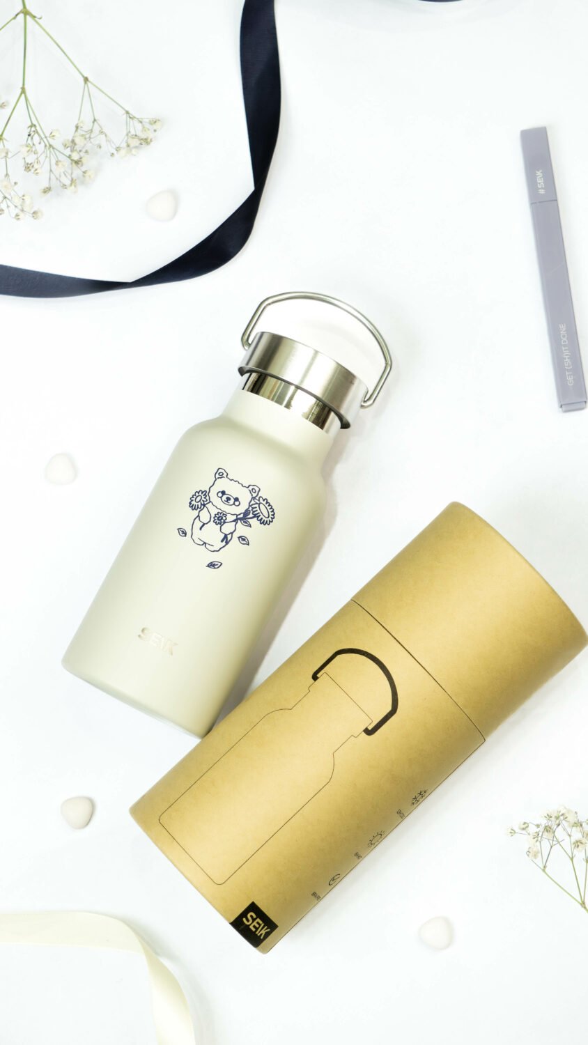 3. SEIK beige water bottle with bear design and elegant recycled packaging, shown in lifestyle setting