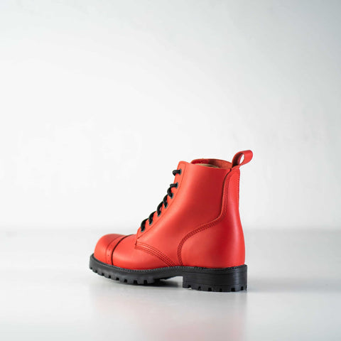 2. Side view of unisex red Aviator Boots by Samelin, highlighting sleek design and black laces