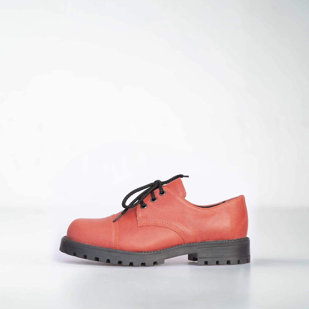 4. Left side view of unisex red leather sneakers by Samelin, showcasing black laces and robust outsole