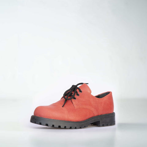 1. Unisex red leather sneakers by Samelin, shown in a studio setting with black laces and rugged outsole