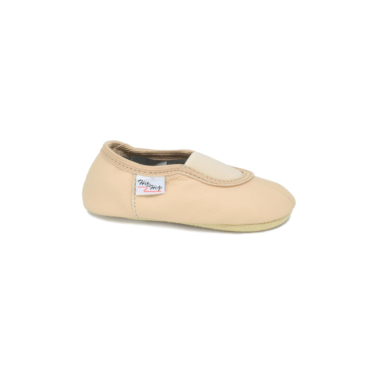 3. Side view of kids' beige leather slipper by Hip-Hop, highlighting elastic band and felt insole