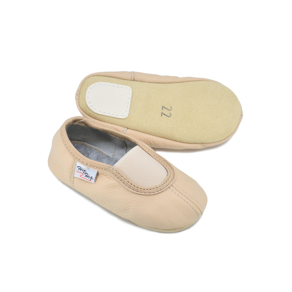 2. Kids' beige leather slippers by Hip-Hop, showing top and bottom view with non-slip rubber patch