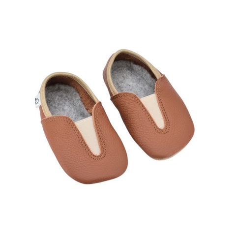 2. Studio image of Hip-Hop Punsa Kids Barefoot Slippers in terracotta, showing upcycled leather and wide toe box design