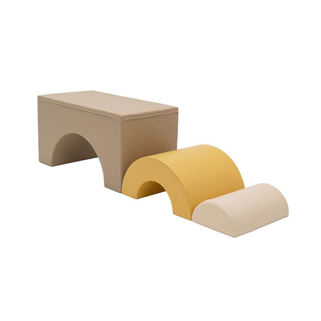 4. Flat lay of modular soft play set in beige and honey, arranged in tunnel formation