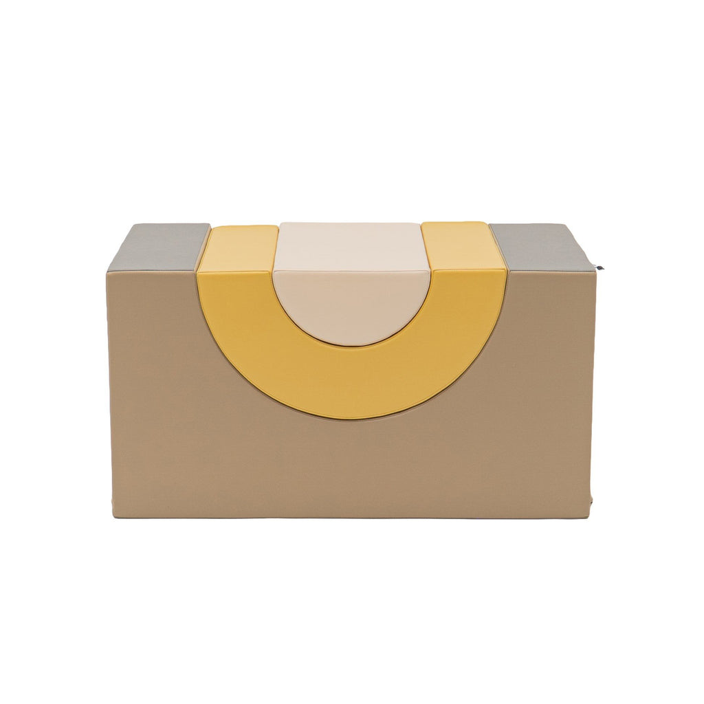 2. Top view of beige and honey soft play block with rainbow design, studio background