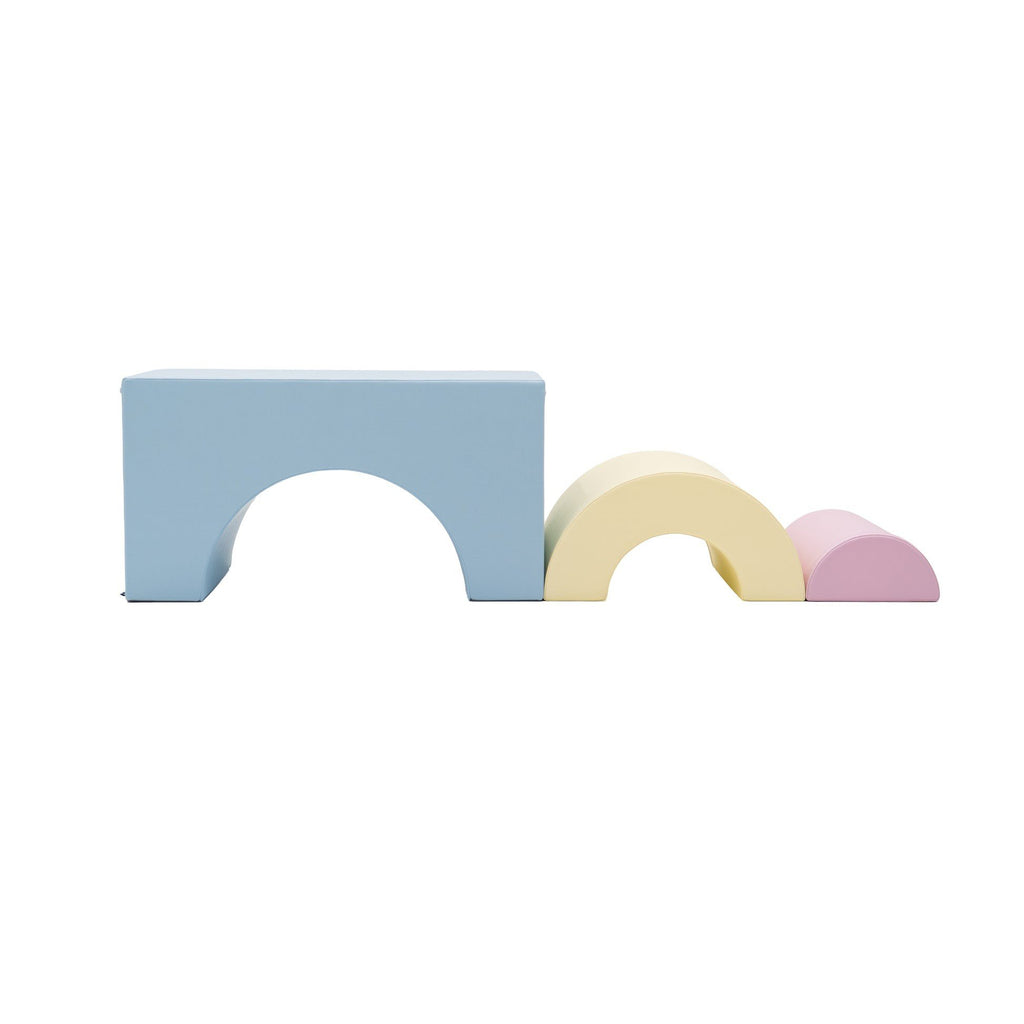 5. Light pastel soft play set arranged in bridge and tunnel shapes on white background