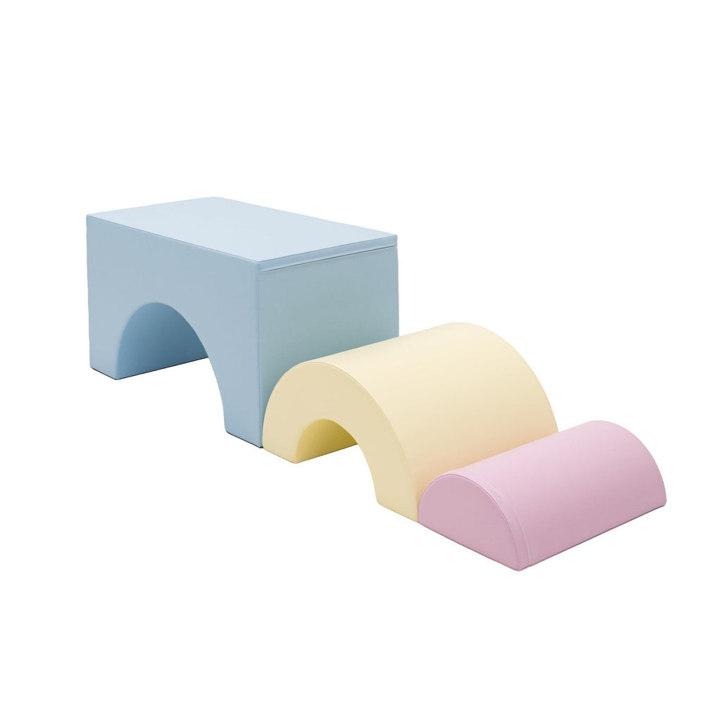 7. Light pastel soft play set arranged in bridge formation with blue, yellow, and pink pieces