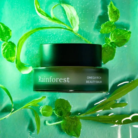 2. Usva Cosmetics Rainforest Omega Rich Beauty Balm in green jar with black lid, shown with green leaves