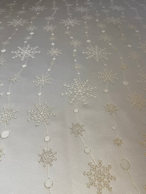 2. Close-up of golden snowflake pattern on rectangular tablecloth fabric