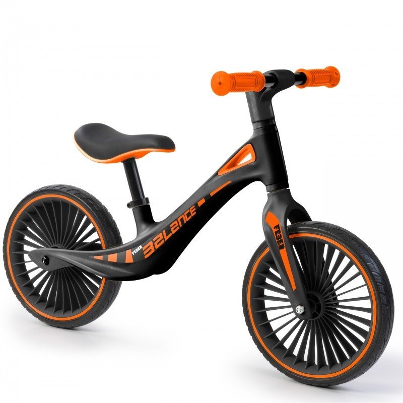 2. Side view of Feber balance bike with orange accents on white background