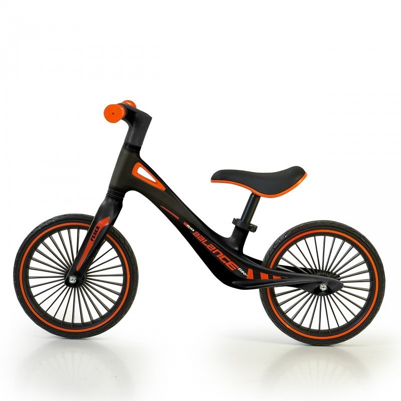 2. Black and orange Feber balance bike with adjustable saddle and anti-puncture wheels on white background