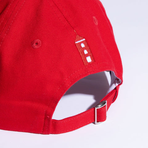 3. Back view of Moomin by NordicBuddies red cap showing adjustable strap and lighthouse embroidery