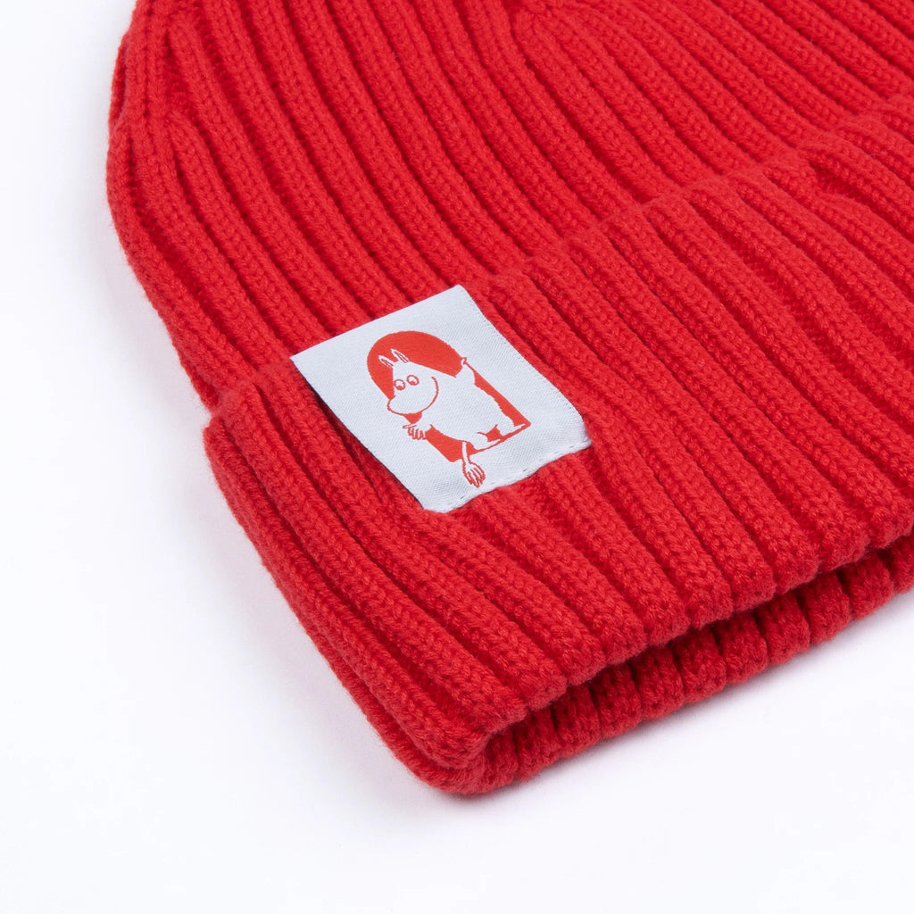 2. Close-up of Moomin Red Cross Beanie showing detailed Moomin character patch on red ribbed acrylic fabric