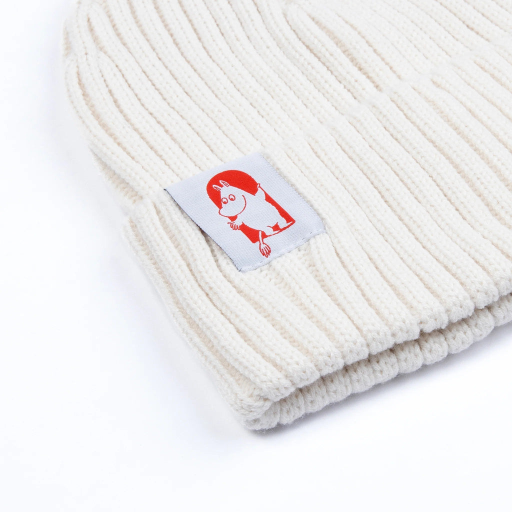 2. Close-up of white Moomin by NordicBuddies Red Cross Beanie, highlighting Moomin character patch and ribbed texture