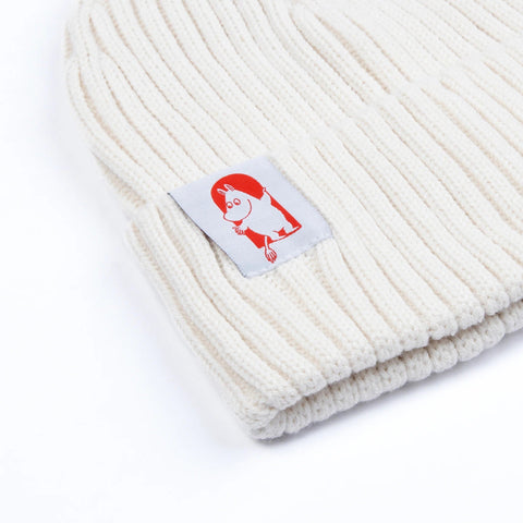 2. Close-up of white Moomin by NordicBuddies Red Cross Beanie, highlighting Moomin character patch and ribbed texture