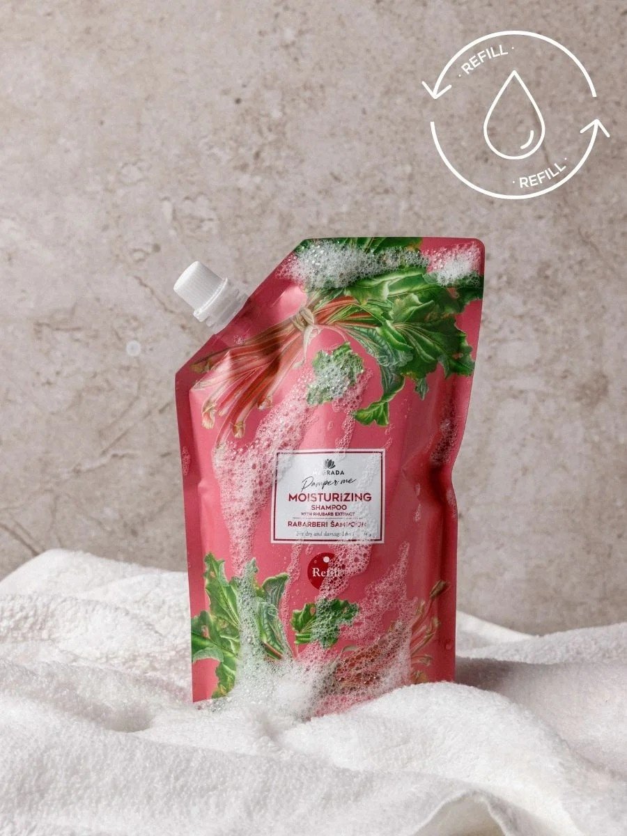 1. Magrada Organic Cosmetics rhubarb shampoo refill pack on white towel, showcasing eco-friendly design